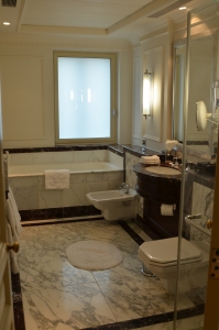 Single vanity with a shower/tub combination.