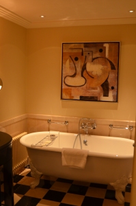 Claw foot soaking tub.  The artwork is in the shower rooms in the suites.